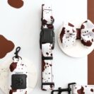 etui na kupoworki dla psa w brązowo-białe krowie łaty – kolekcja Puppy Cow